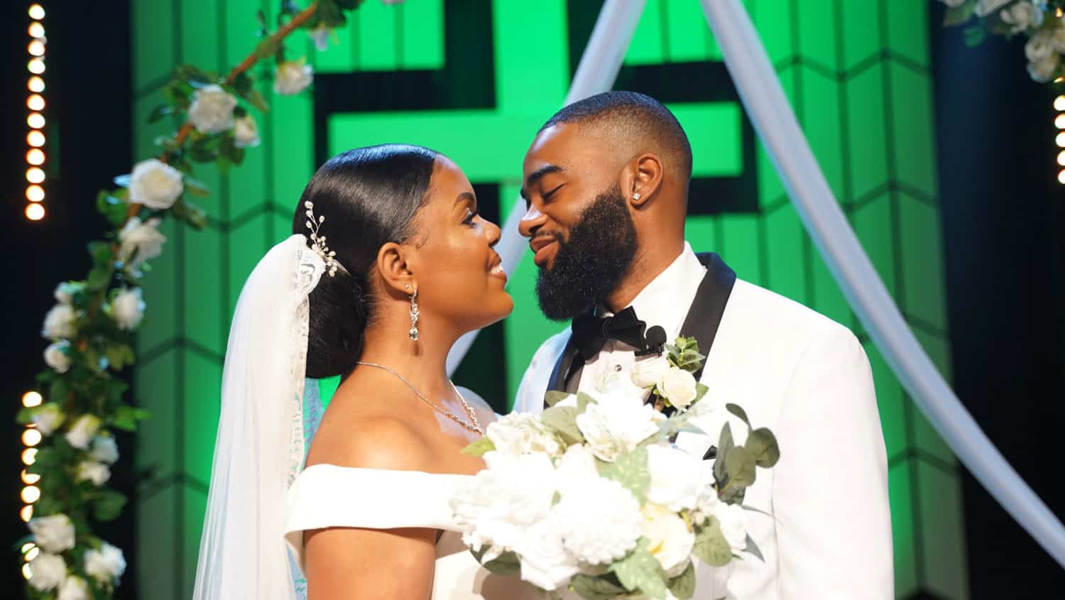 Bride and groom sharing a moment during wedding ceremony at Prime Time Event.