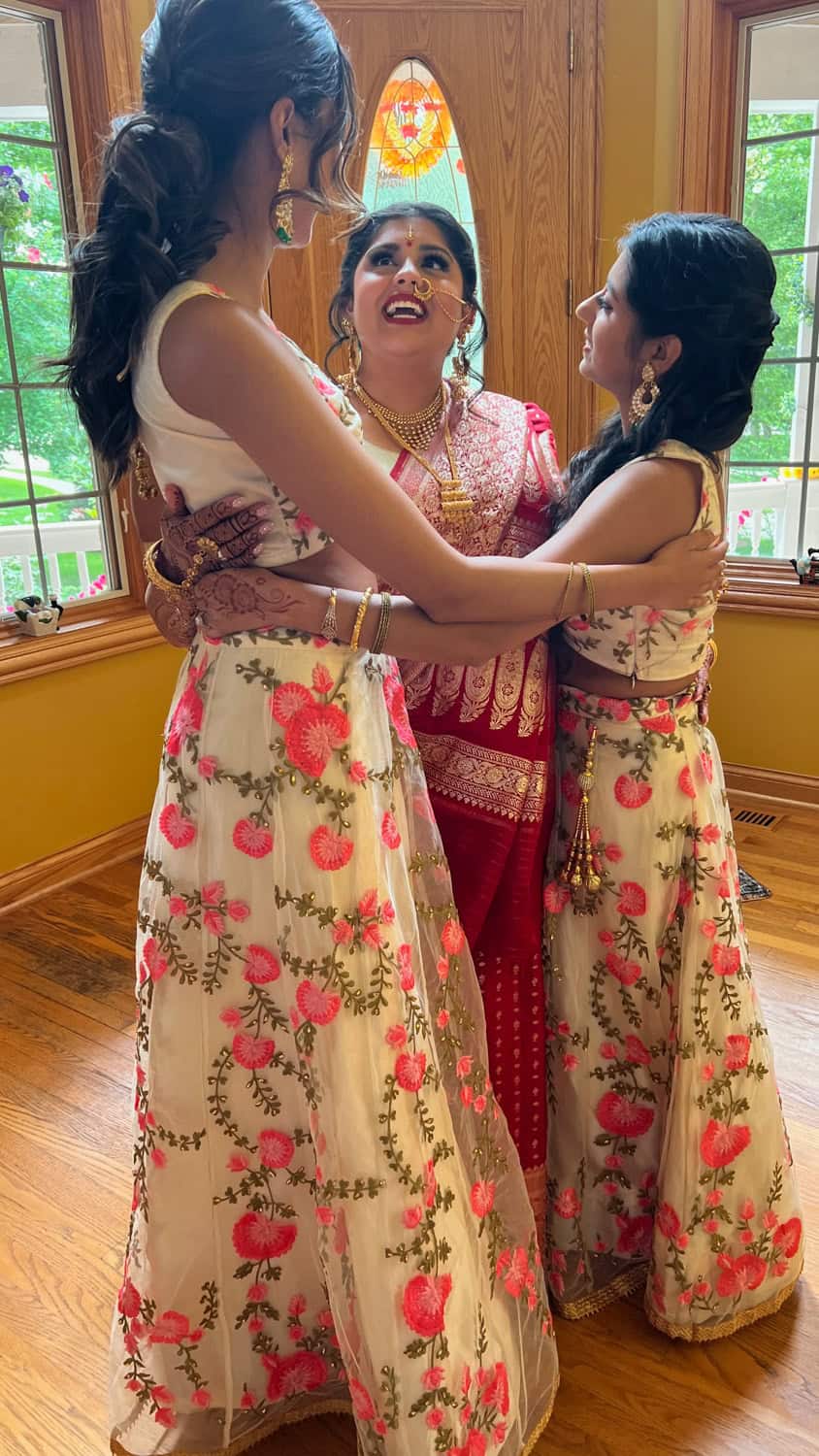 Women in traditional attire celebrating at Prime Time Event Planning.