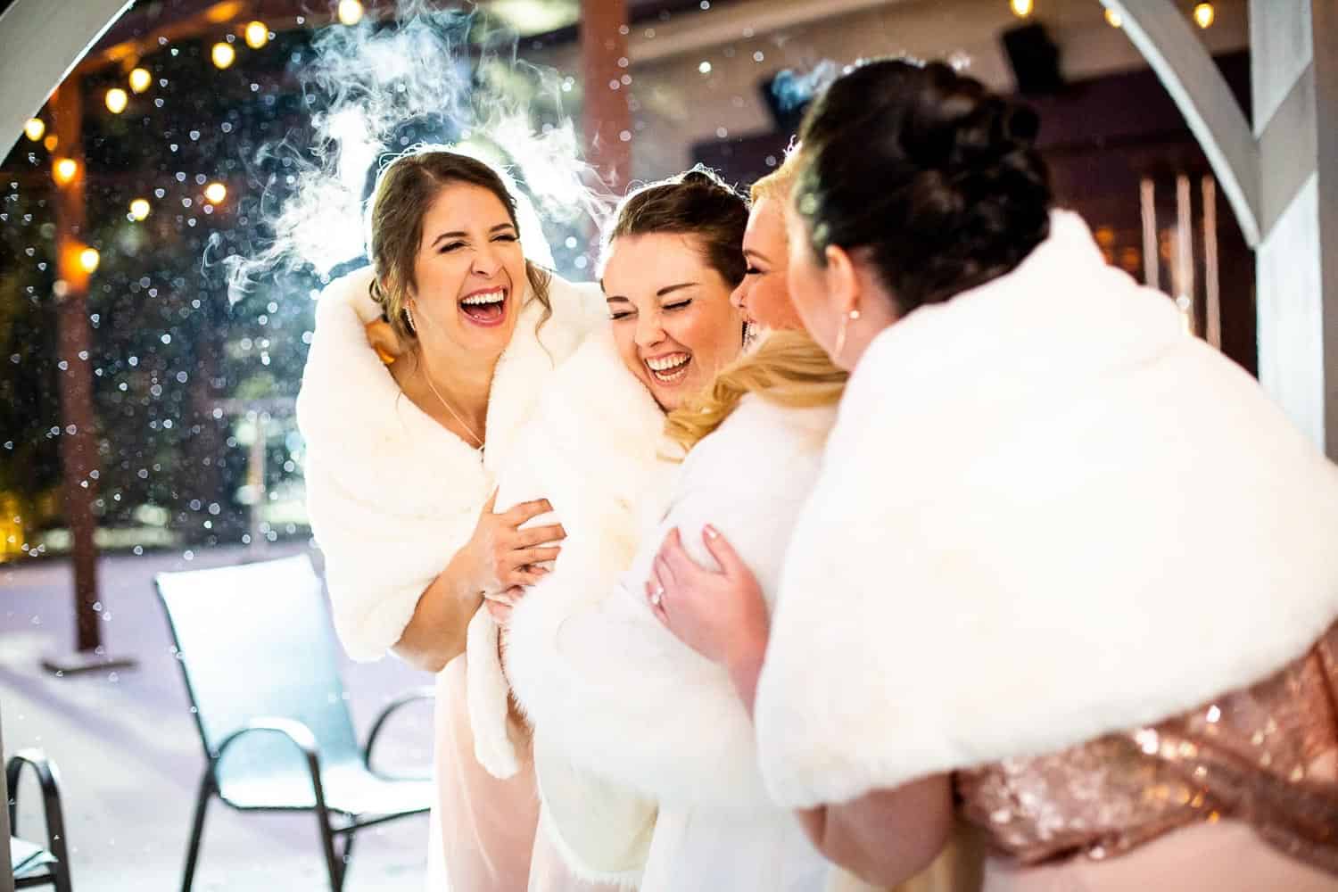 Group of women celebrating at an event with joyful expressions.
